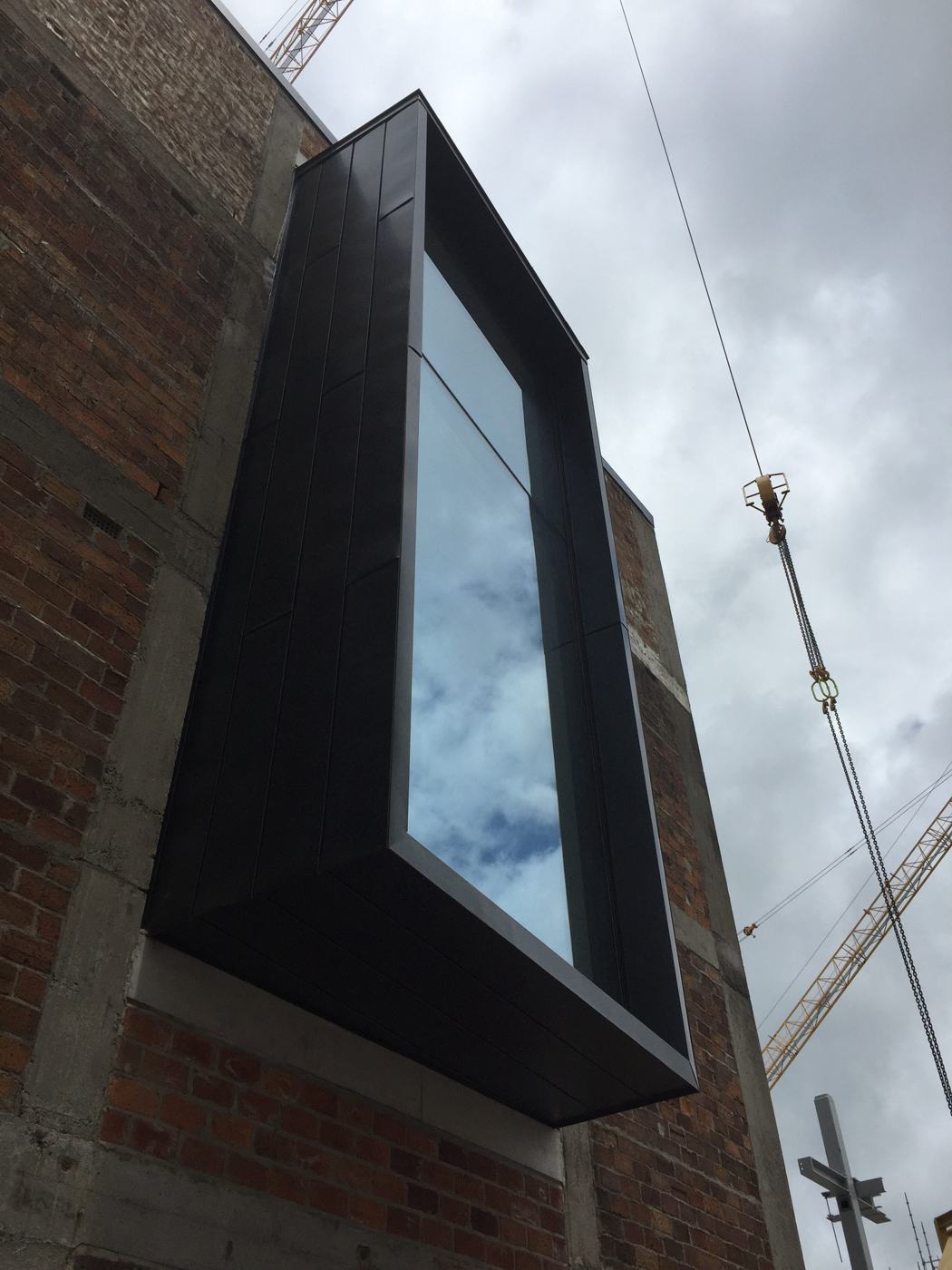 Zinc-clad window box on the Mason Bros brick façade
